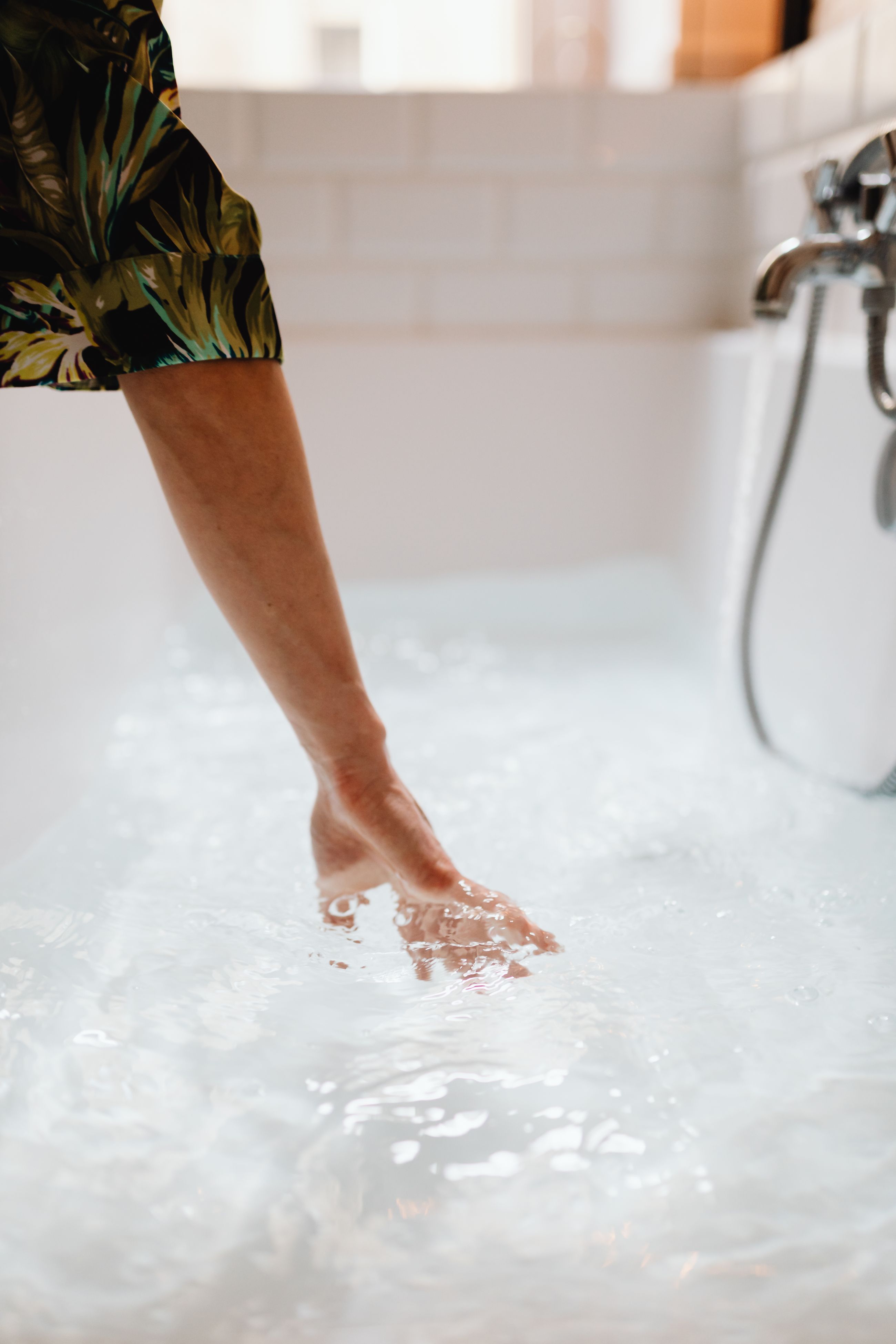 Hands resting in still mineral water
